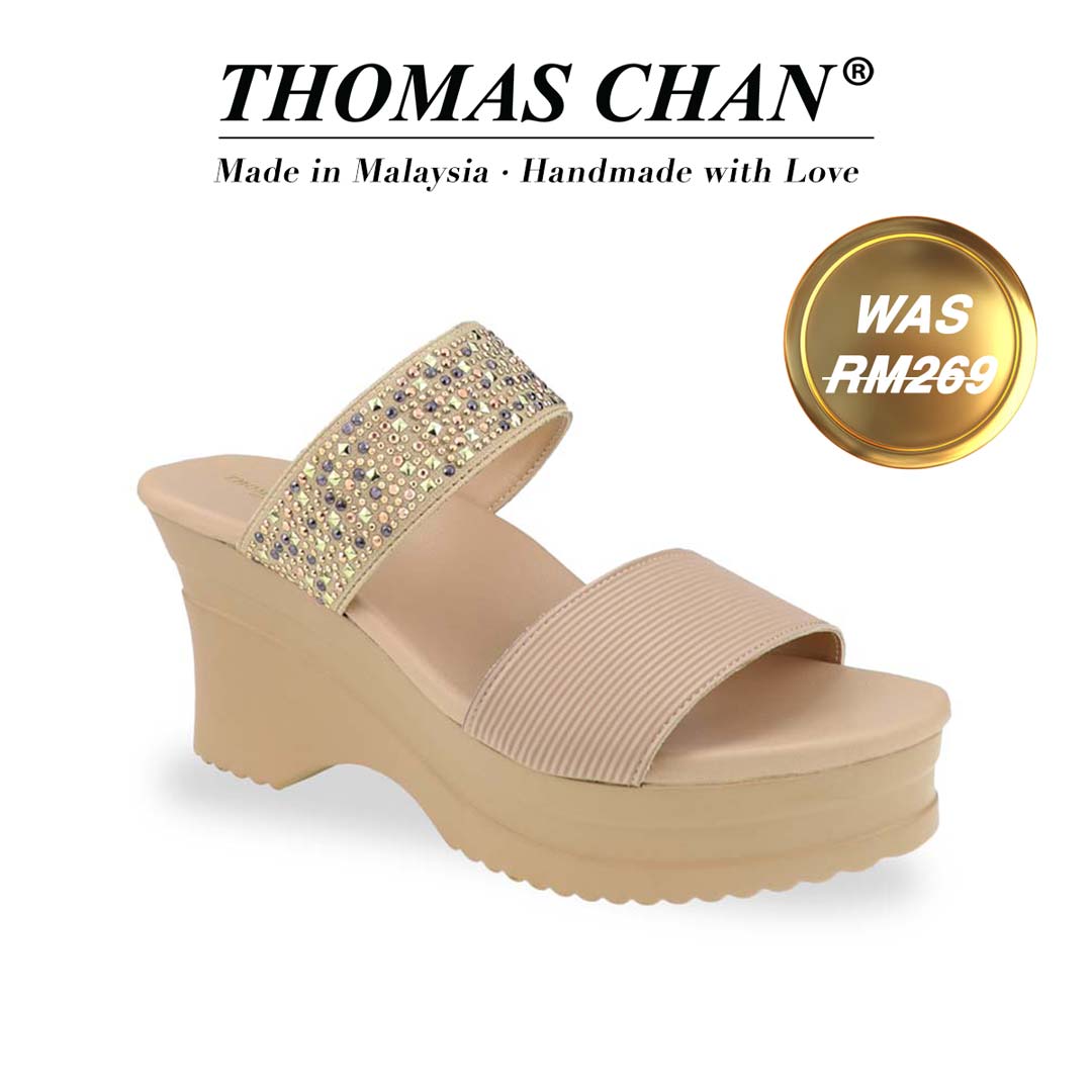 Diagonal view of Thomas Chan's Strappy Rhinestone Cushioned Heels in cream: With a built-in cushioned footbed and a chic two-strap design, these heels offer a sleek front stripe complemented by a dazzling rhinestone strap at the back."THOMAS CHAN®" brand displayed with "Made in Malaysia · Handmade with Love" below. Gold and white banner highlights special offer: "Was RM269"