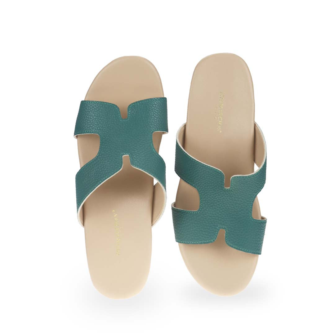 Front view of Thomas Chan's H-Strap Cushioned Heels in green color: Crafted for all-day comfort, these sandals boast built-in cushioned insoles and are made from microfiber leather with a pebbled texture.