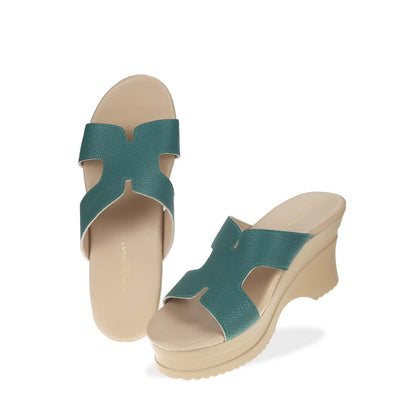 Full view of Thomas Chan's H-Strap Cushioned Heels in green color: Crafted for all-day comfort, these sandals boast built-in cushioned insoles and are made from microfiber leather with a pebbled texture.