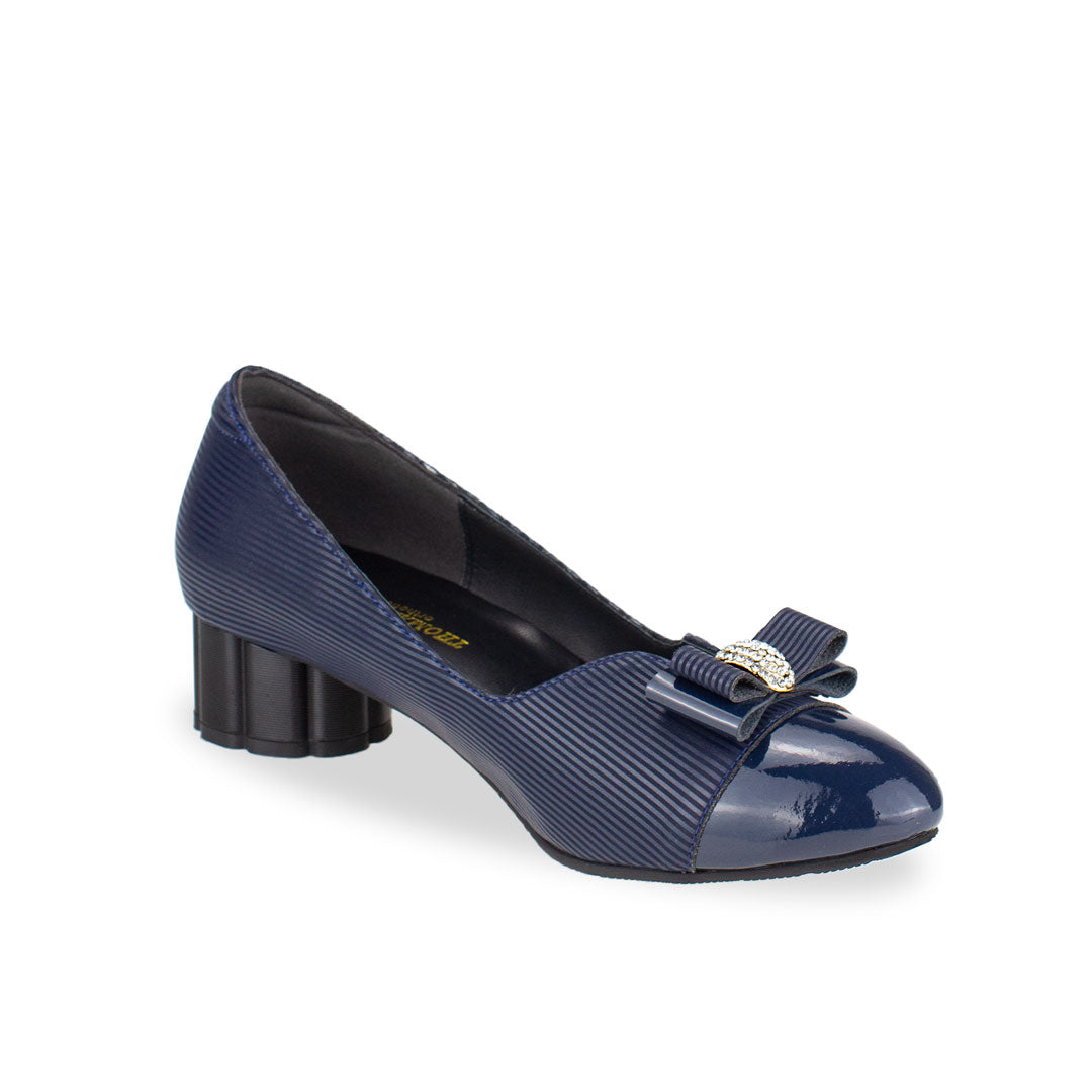 Diagonal view of Thomas Chan handmade blue low heel pumps with diamond rhinestone ribbon buckle