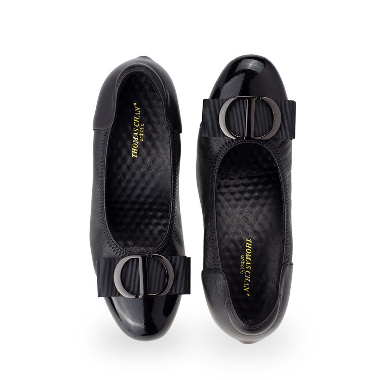 Front view of Thomas Chan black-colored ribbon buckle court shoes, featuring patent black detail at the toe cover