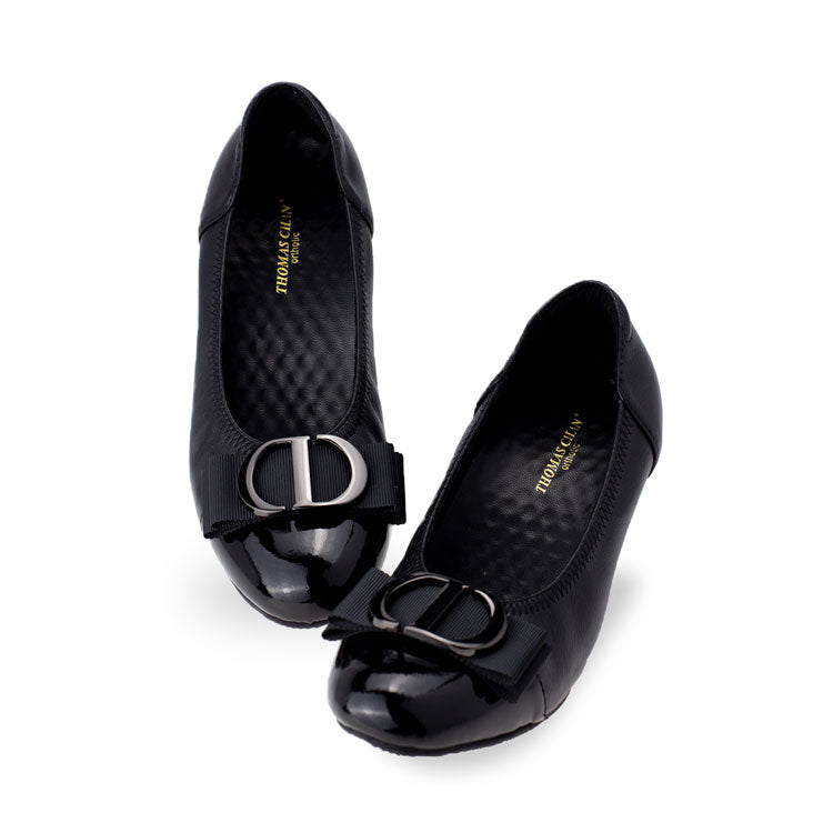 Full view of Thomas Chan black-colored ribbon buckle court shoes, featuring patent black detail at the toe cover