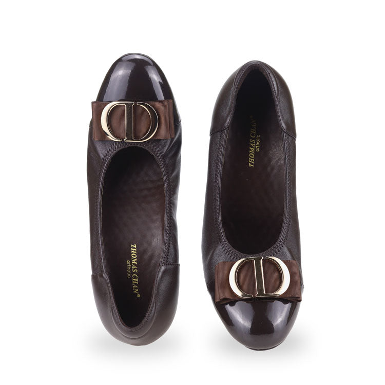 Front view of Thomas Chan dark brown-colored ribbon buckle court shoes, featuring patent dark brown detail at the toe cover.