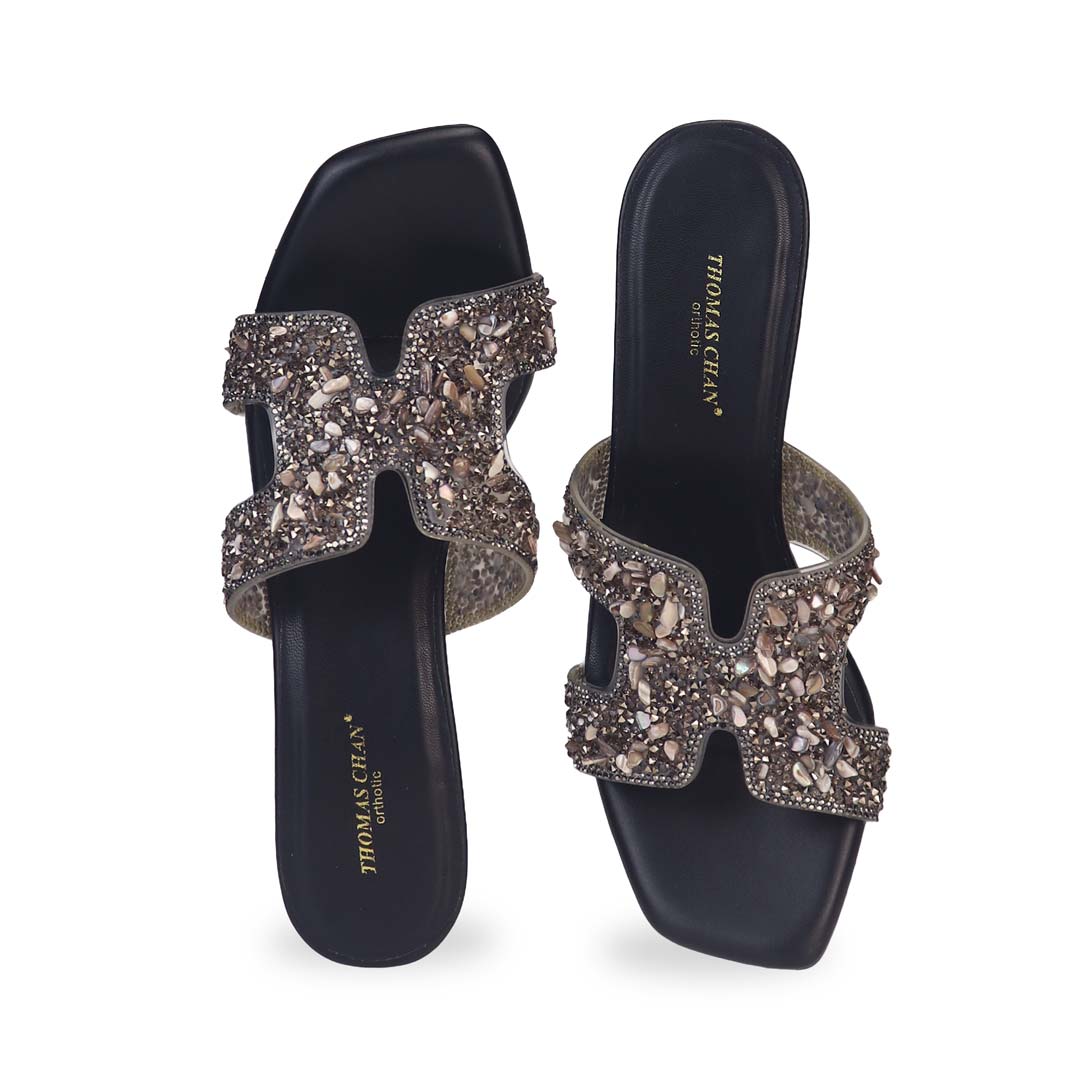 Front view of Thomas Chan's Sparkle Jewel H-Strap Heeled Sandals in black, showcasing an elegant design and a uniquely crafted heel.