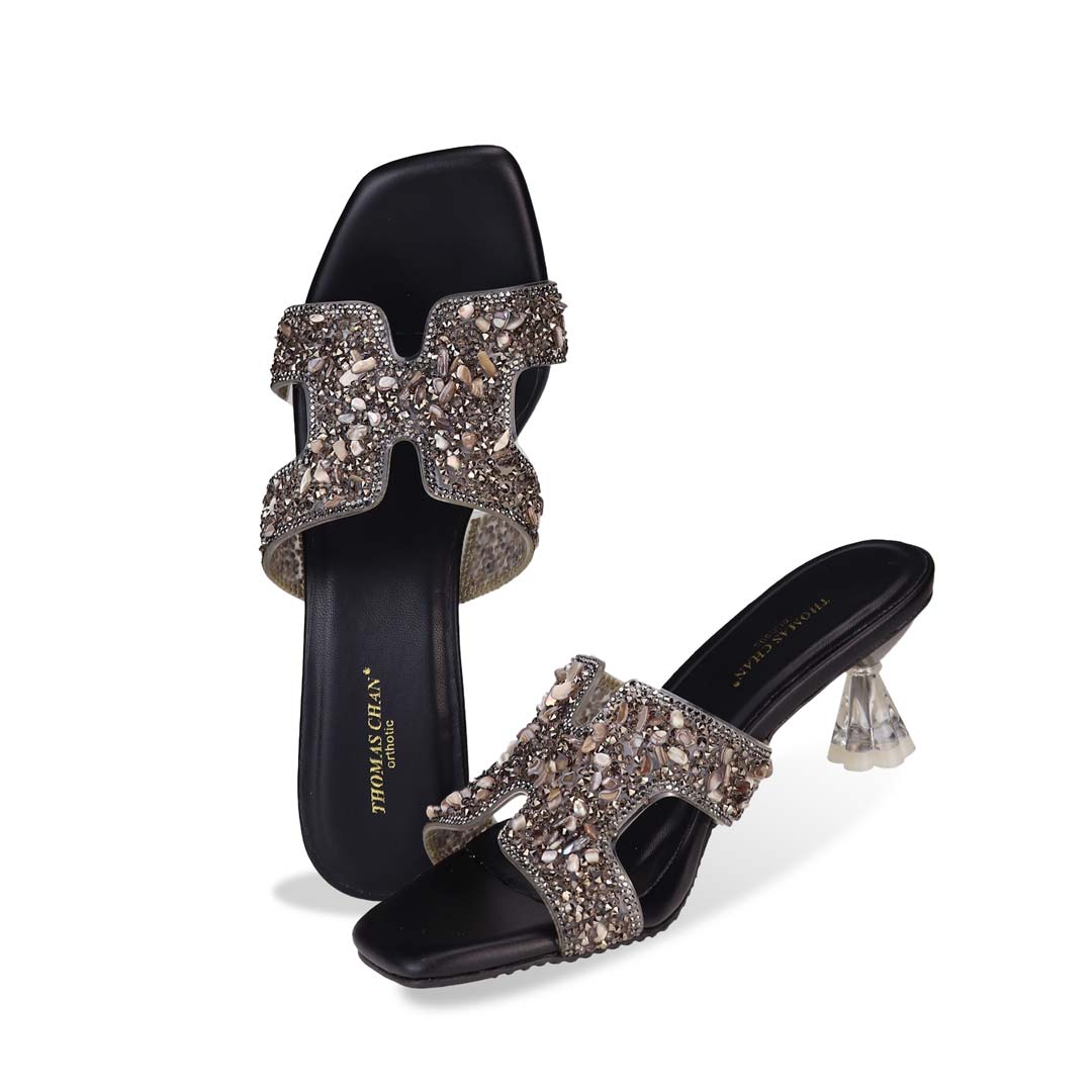 Full view of Thomas Chan's Sparkle Jewel H-Strap Heeled Sandals in black, showcasing an elegant design and a uniquely crafted heel.