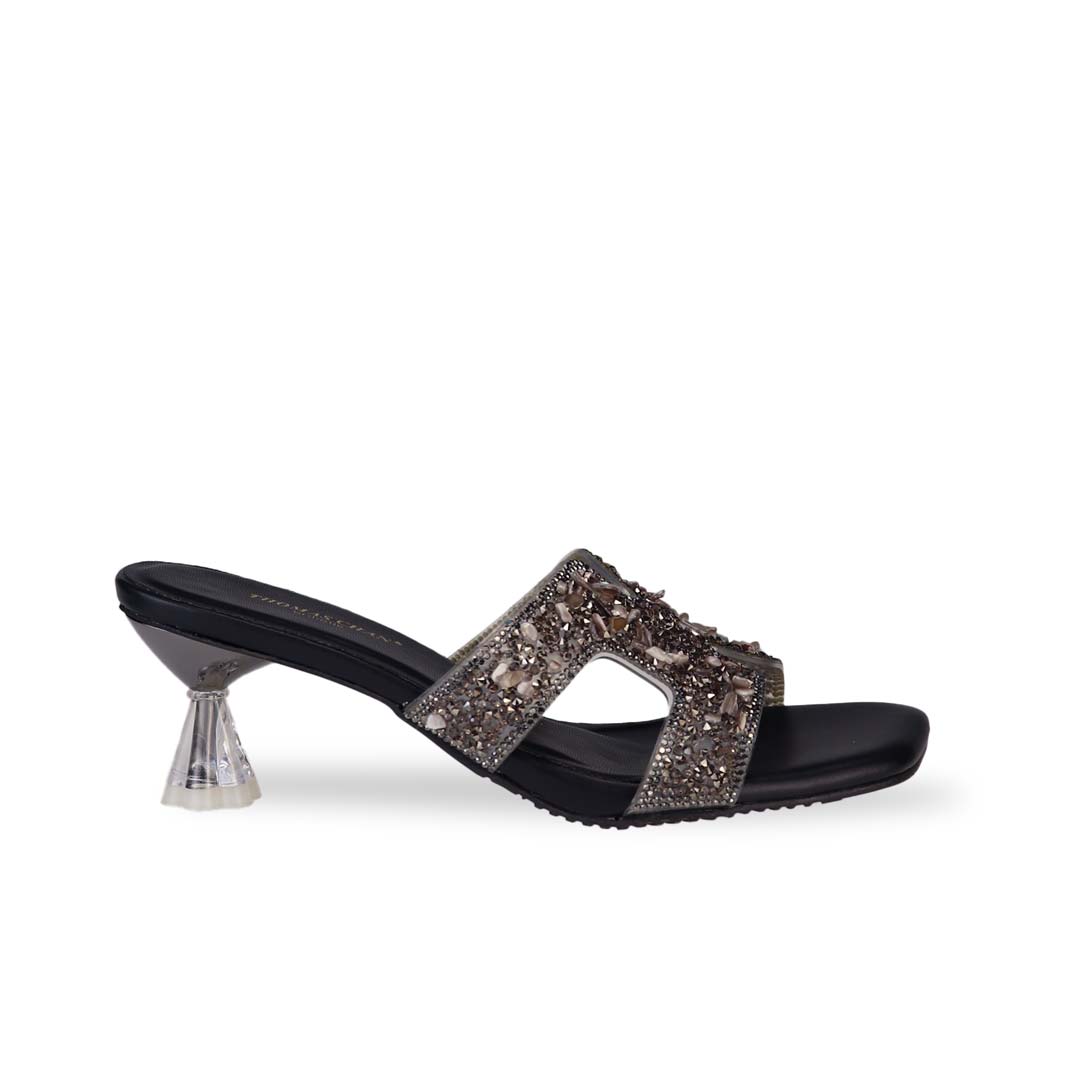 Side view of Thomas Chan's Sparkle Jewel H-Strap Heeled Sandals in black, showcasing an elegant design and a uniquely crafted heel.