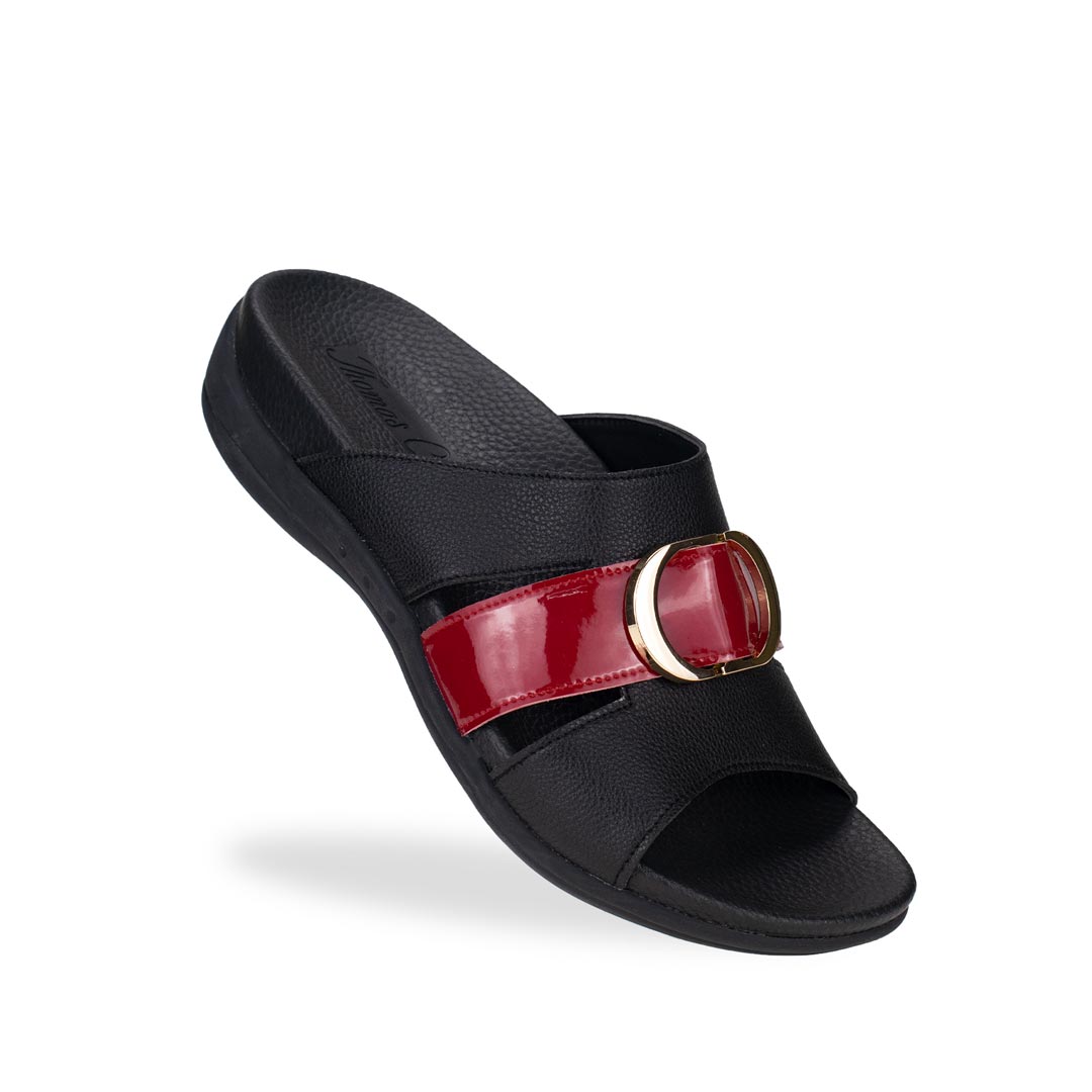 Diagonal view of Thomas Chan PU slide sandals with basic logo buckle in black, featuring a mixture of red patent in the middle and in-built soft arch support insole