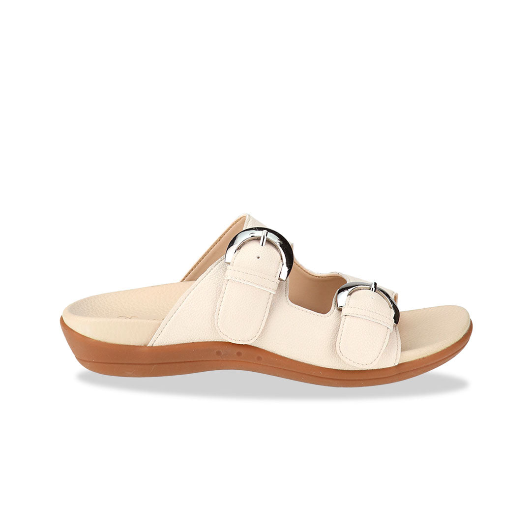 Diagonal view of Thomas Chan's Duo Buckle Slide-One Flat Sandals in ivory, displaying an elegant design with an arch-support footbed.