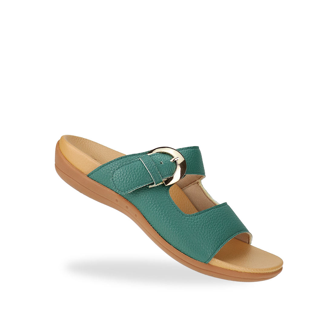 Diagonal view of Great Coverage Buckle flat sandals in turquoise green, displaying an elegant design with an arch-support footbed.