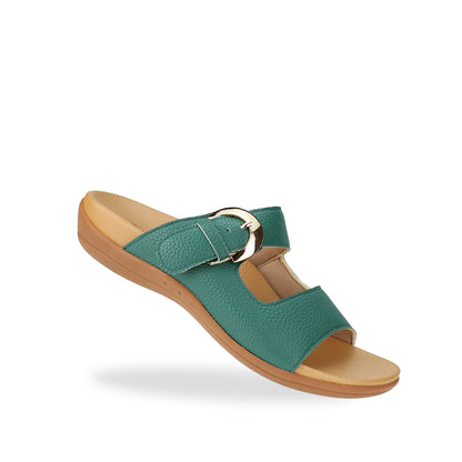 Diagonal view of Great Coverage Buckle flat sandals in turquoise green, displaying an elegant design with an arch-support footbed.