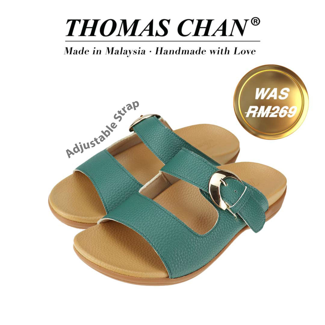 Thomas Chan's Great Coverage Buckle Flat Sandals in turquoise green, featuring an elegant design with an arch-support footbed. The 'THOMAS CHAN®' brand is prominently displayed with 'Made in Malaysia · Handmade with Love' below. A gold and white banner highlights the special offer: ' Was 269' The sandals also feature an adjustable strap.