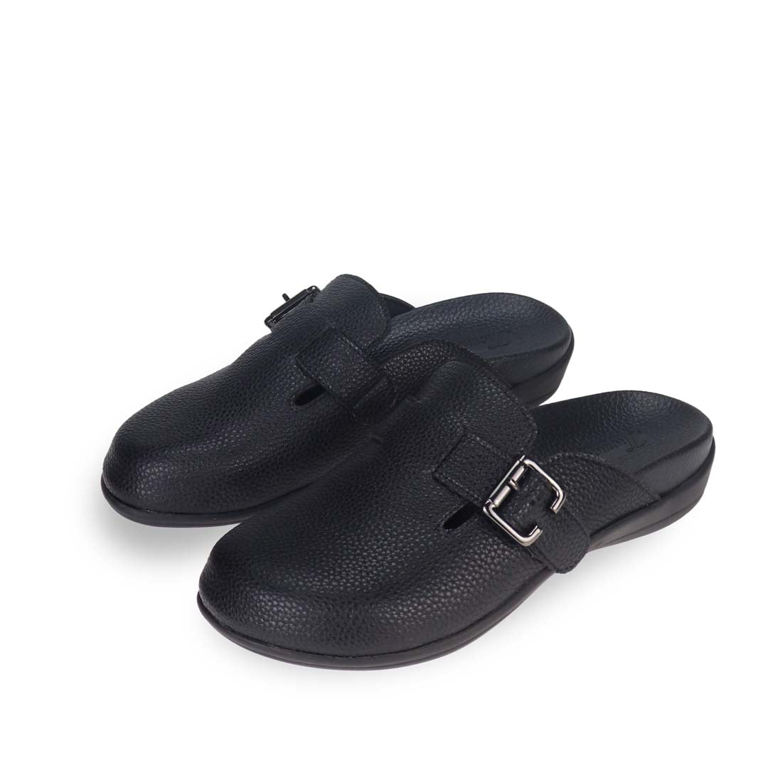 Full view of Thomas Chan's closed-toe buckle sandals in black colour with pebbled texture, the sandals feature a sleek design with a black buckle strap across the top and a black inner lining, with arch-support footbed.