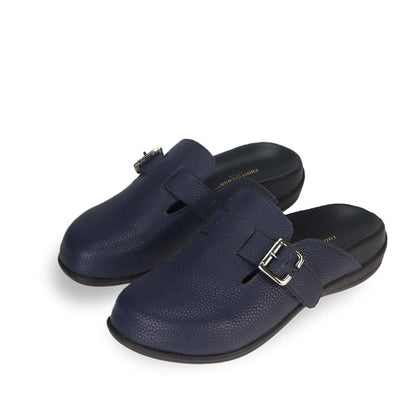 Full view of Thomas Chan's closed-toe buckle sandals in blue colour with pebbled texture, the sandals feature a sleek design with a silver buckle strap across the top and a black inner lining, with arch-support footbed.