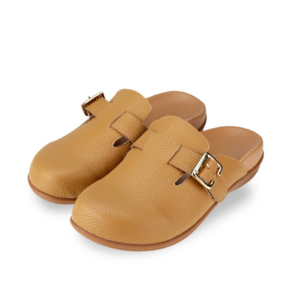 Full view of Thomas Chan's closed-toe buckle sandals in tan colour with pebbled texture, the sandals feature a sleek design with a silver buckle strap across the top and a foam inner lining, with arch-support footbed.