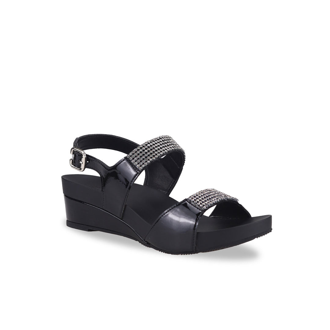 Diagonal view of Thomas Chan black Diamond Strappy Slingback Low Wedges, featuring handpicked multi-row rhinestone straps and the exclusive Thomas Chan® Orthotic Arch-legance footbed for stylish comfort, complete with a breathable slingback design.