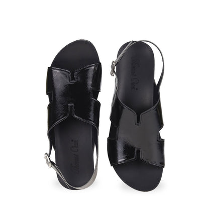 Front view of Thomas Chan H-Strap with Slingback Low Wedge Sandals in black, featuring a mixture of silver patent at the slingback, ensuring comfortable wear and an easy walking experience.