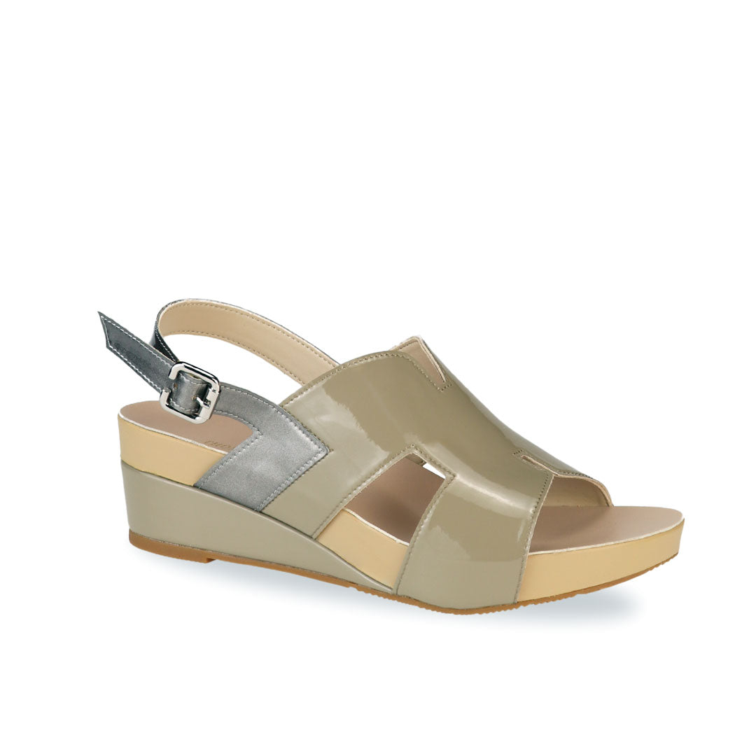 Diagonal view of Thomas Chan H-Strap with Slingback Low Wedge Sandals in ivory green, featuring a mixture of silver patent at the slingback, ensuring comfortable wear and an easy walking experience.