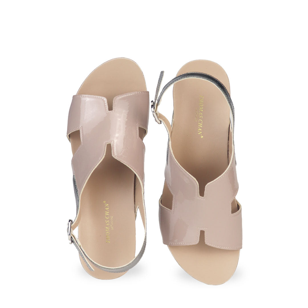 Front view of Thomas Chan H-Strap with Slingback Low Wedge Sandals in light taupe, featuring a mixture of silver patent at the slingback, ensuring comfortable wear and an easy walking experience.