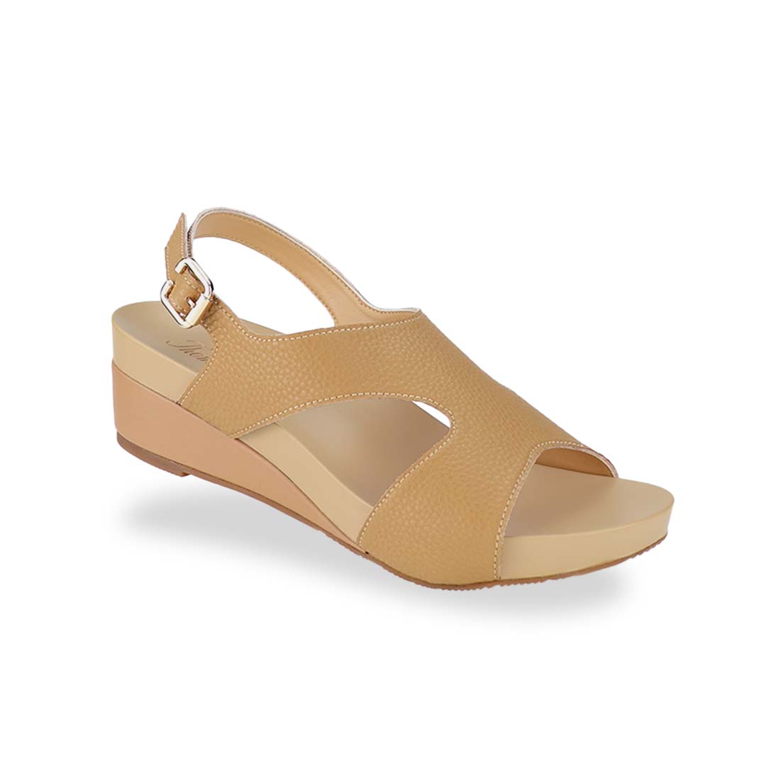 Diagonal view of Thomas Chan Daily Wear Slingback Low Wedges in camel cream, featuring buckle slingback design, and built-in arch-support insoles for enhanced comfort and ease of walking