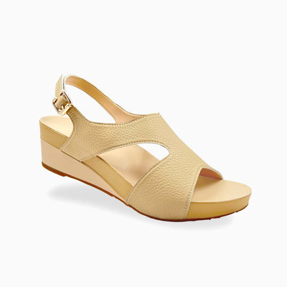 Diagonal view of Thomas Chan Daily Wear Slingback Low Wedges in light mustard cream, featuring buckle slingback design, and built-in arch-support insoles for enhanced comfort and ease of walking