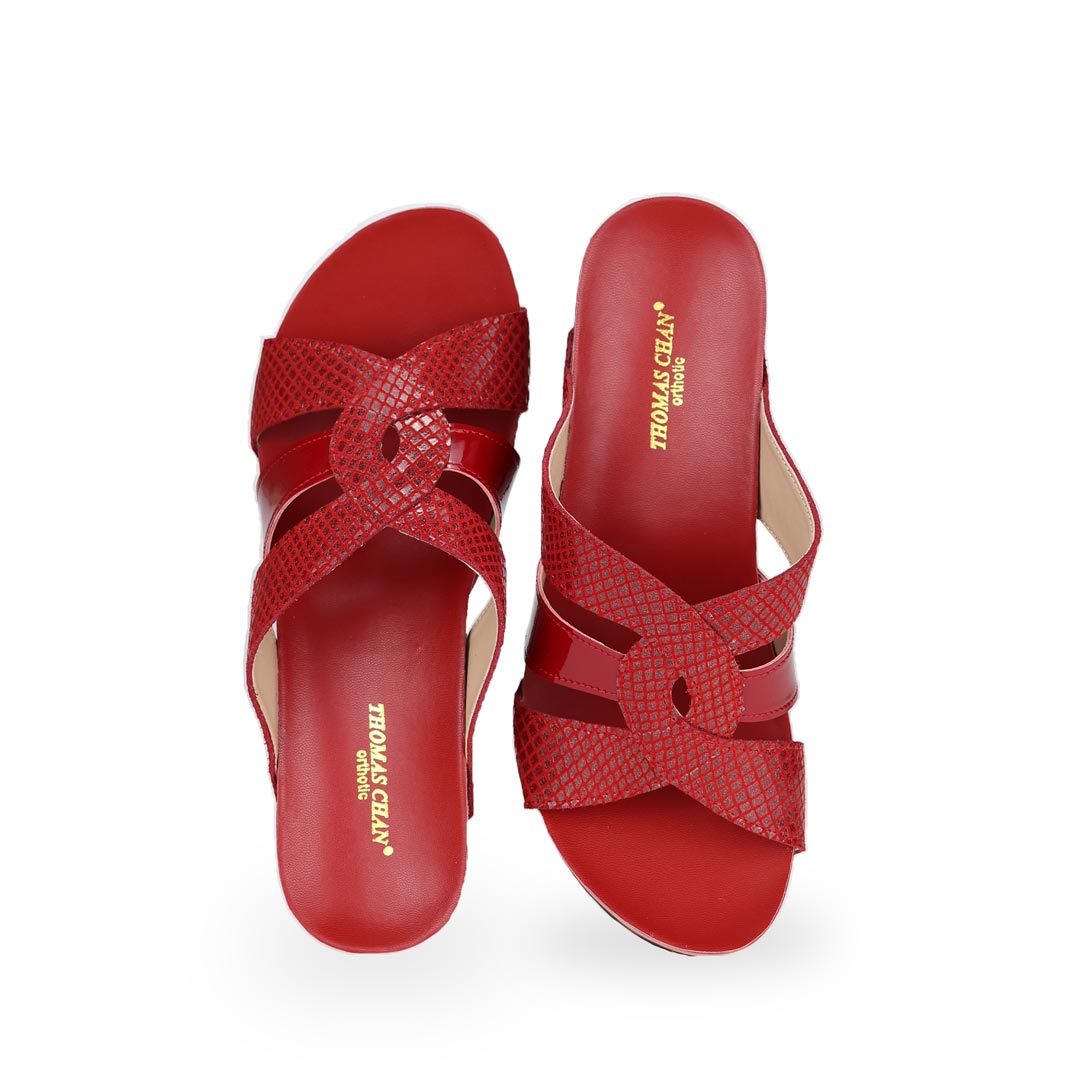 Front view of Thomas Chan classic bright red coloured extra comfortable triple strap snake effect orthotic wedge sandals.