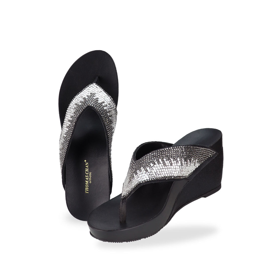 Full view of Thomas Chan Suede Rhinestone Wedge Flip Flops in black colour: Elevate your casual look with a touch of sparkle and comfort. These chic wedge flip flops, adorned with rhinestones, are perfect for adding a hint of glamour to your summer ensemble.