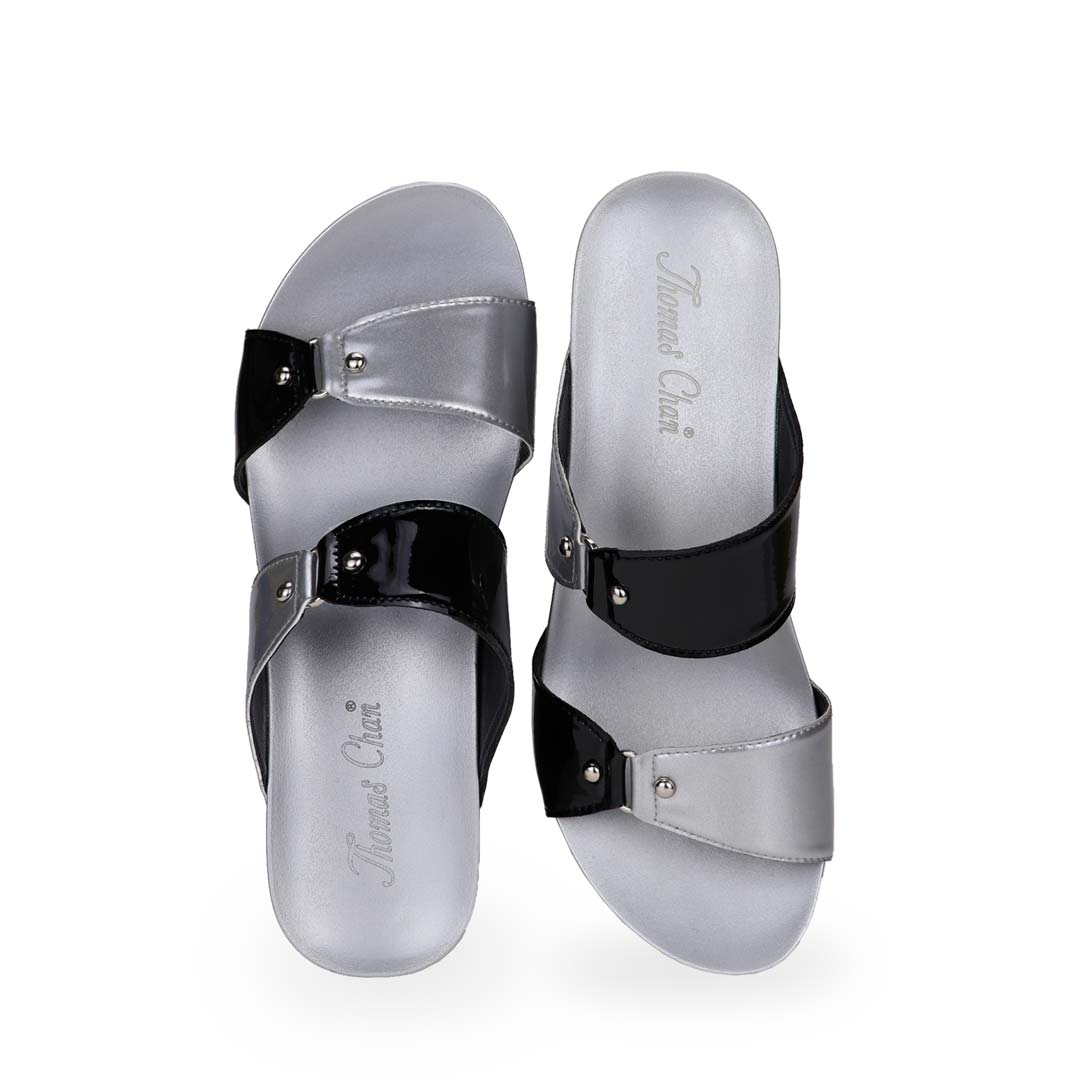 Front view of silver and black colour Thomas Chan bold Yin Yang contrast colour matching studded high wedge sandals with orthotic insoles.