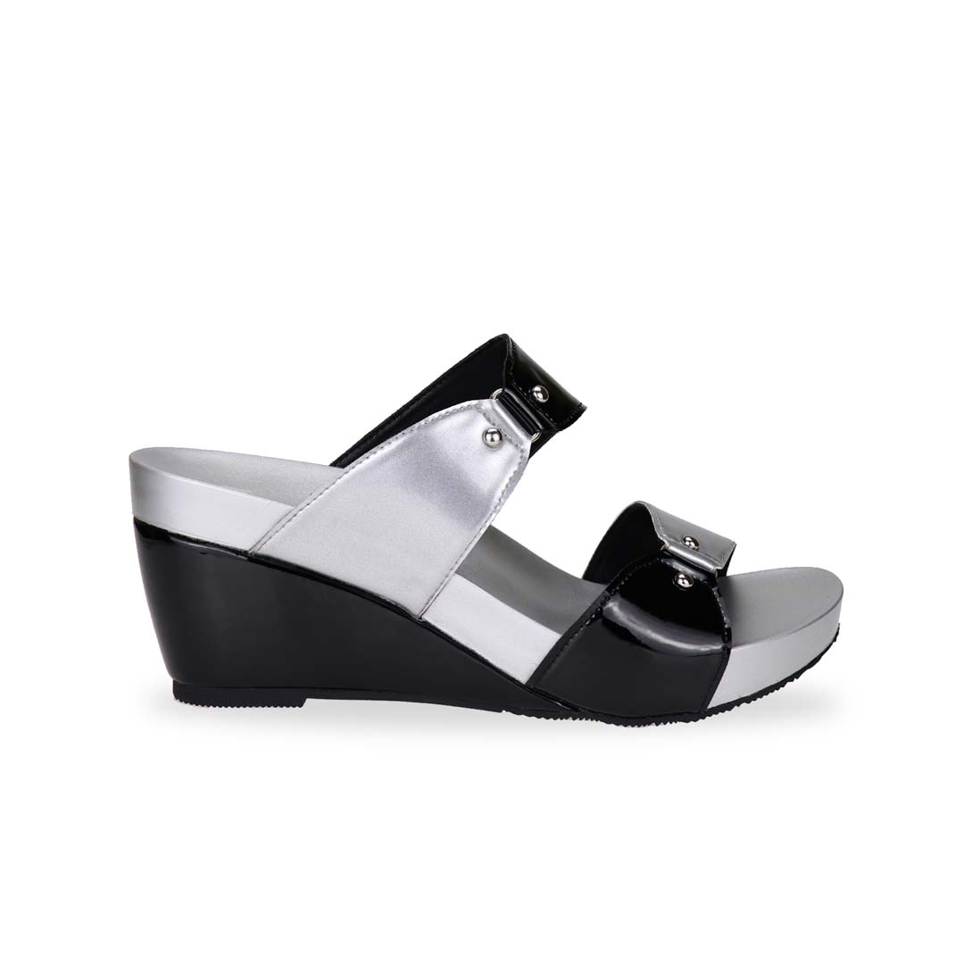 Side view of silver and black colour Thomas Chan bold Yin Yang contrast colour matching studded high wedge sandals with orthotic insoles.