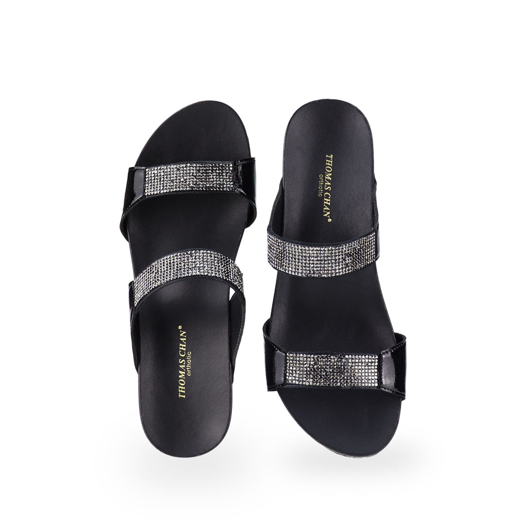 Front view of Thomas Chan black colour Multi-Row Diamond Wedge Sandals, adorned with handpicked multi-row diamond straps and Thomas Chan® Orthotic Arch-elegance footbed for stylish comfort.