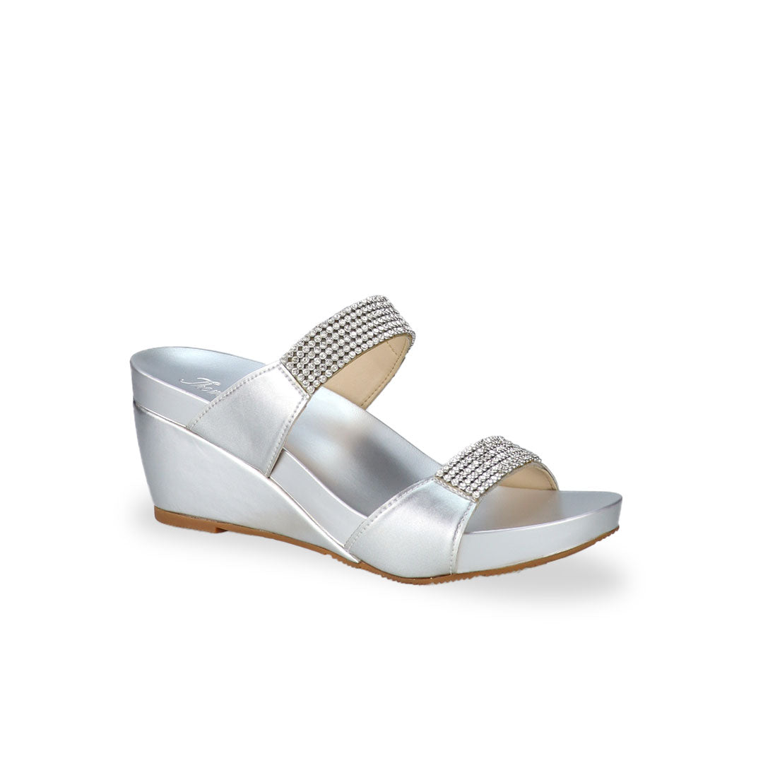 Diagonal view of Thomas Chan silver colour Multi-Row Diamond Wedge Sandals, adorned with handpicked multi-row diamond straps and Thomas Chan® Orthotic Arch-elegance footbed for stylish comfort.