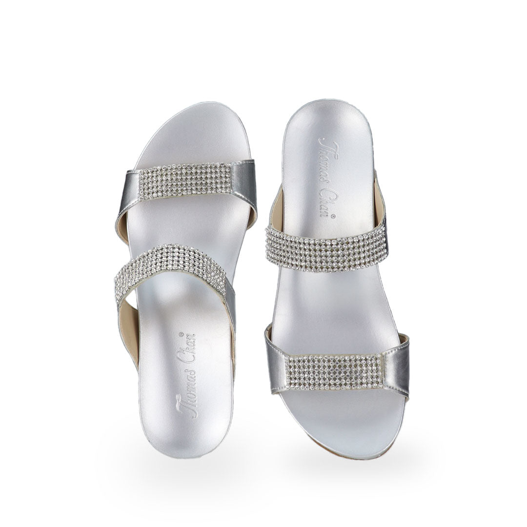 Front view of Thomas Chan silver colour Multi-Row Diamond Wedge Sandals, adorned with handpicked multi-row diamond straps and Thomas Chan® Orthotic Arch-elegance footbed for stylish comfort.