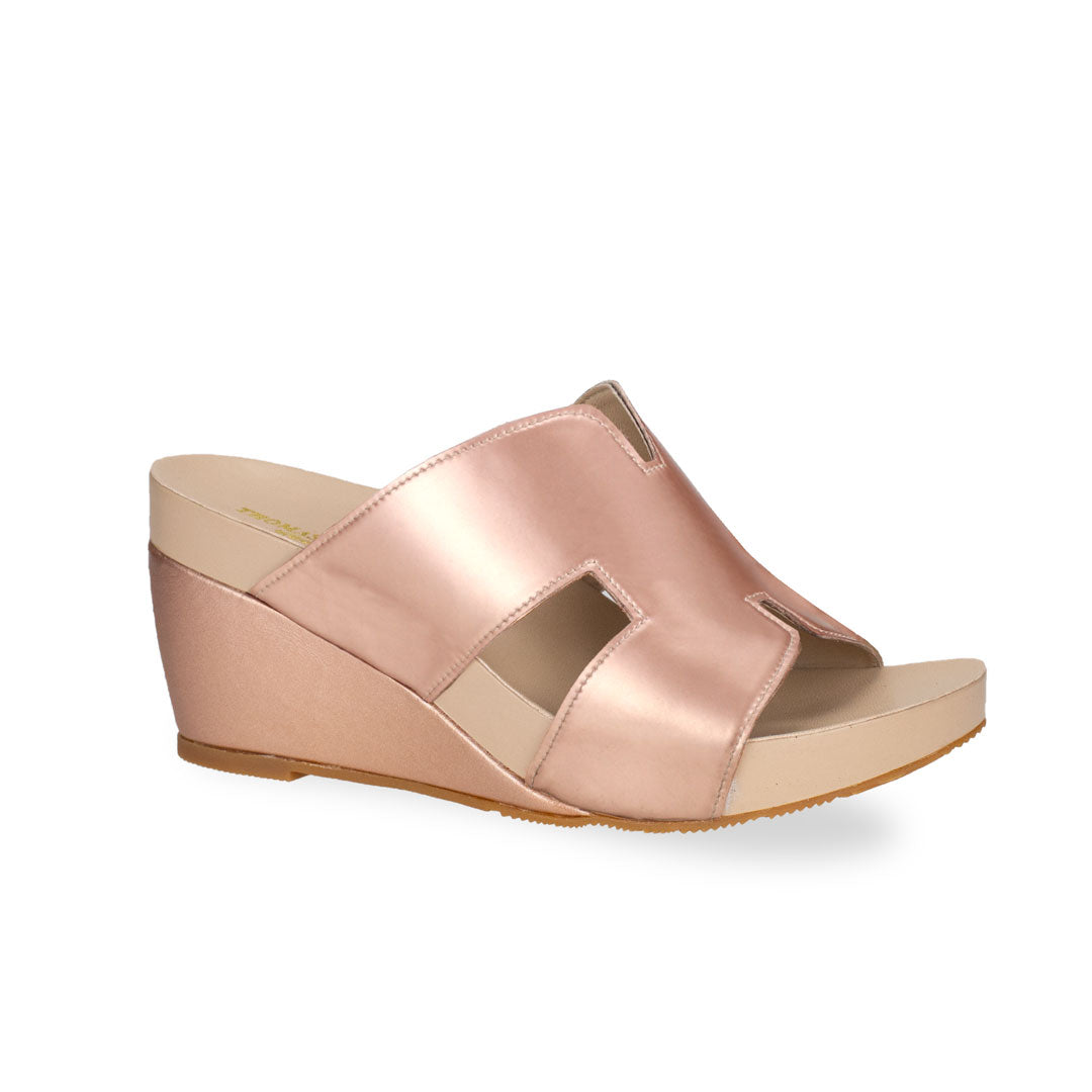 diagonal view of Thomas Chan rose-gold colour simple elegant H strap comfortable wedge sandals