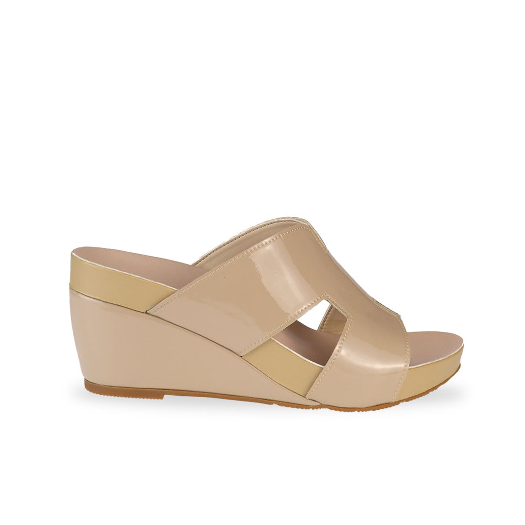 Side view of Thomas Chan cream H-strap wedge sandals, featuring a simple, elegant design with comfortable wedges.