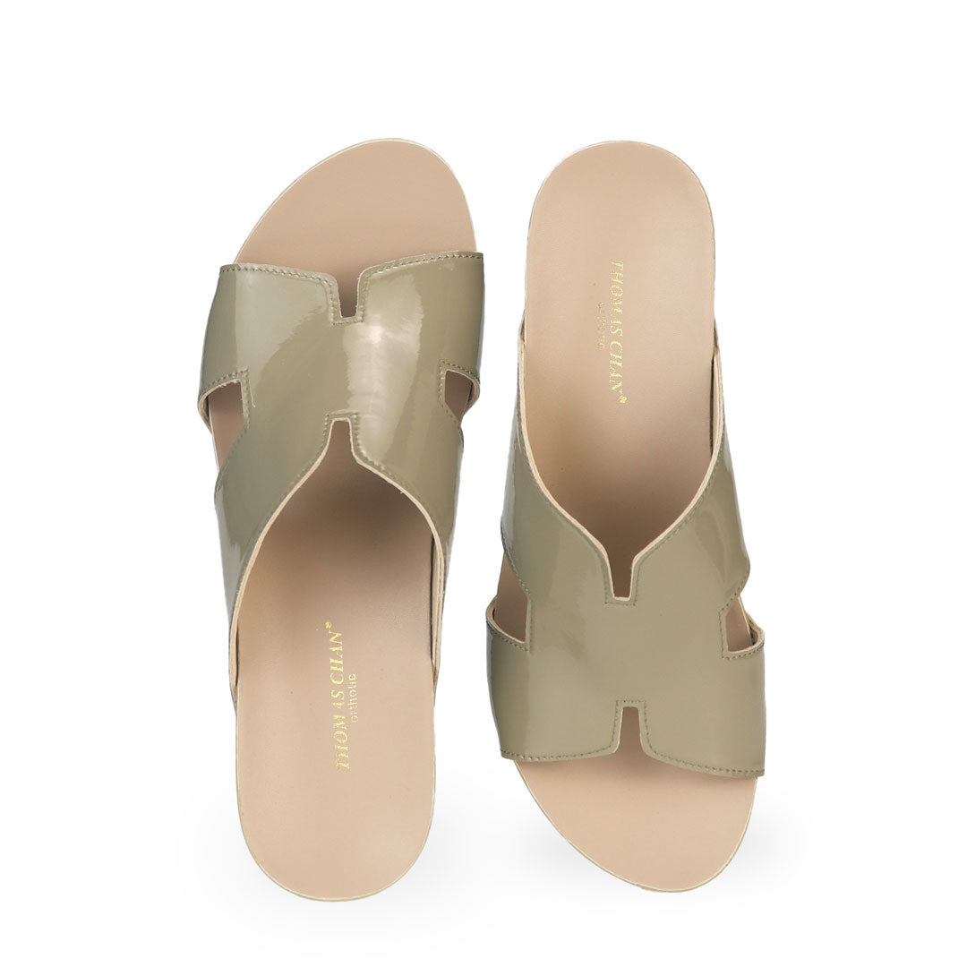 Front view of Thomas Chan ivory green H-strap wedge sandals, featuring a simple, elegant design with comfortable wedges.