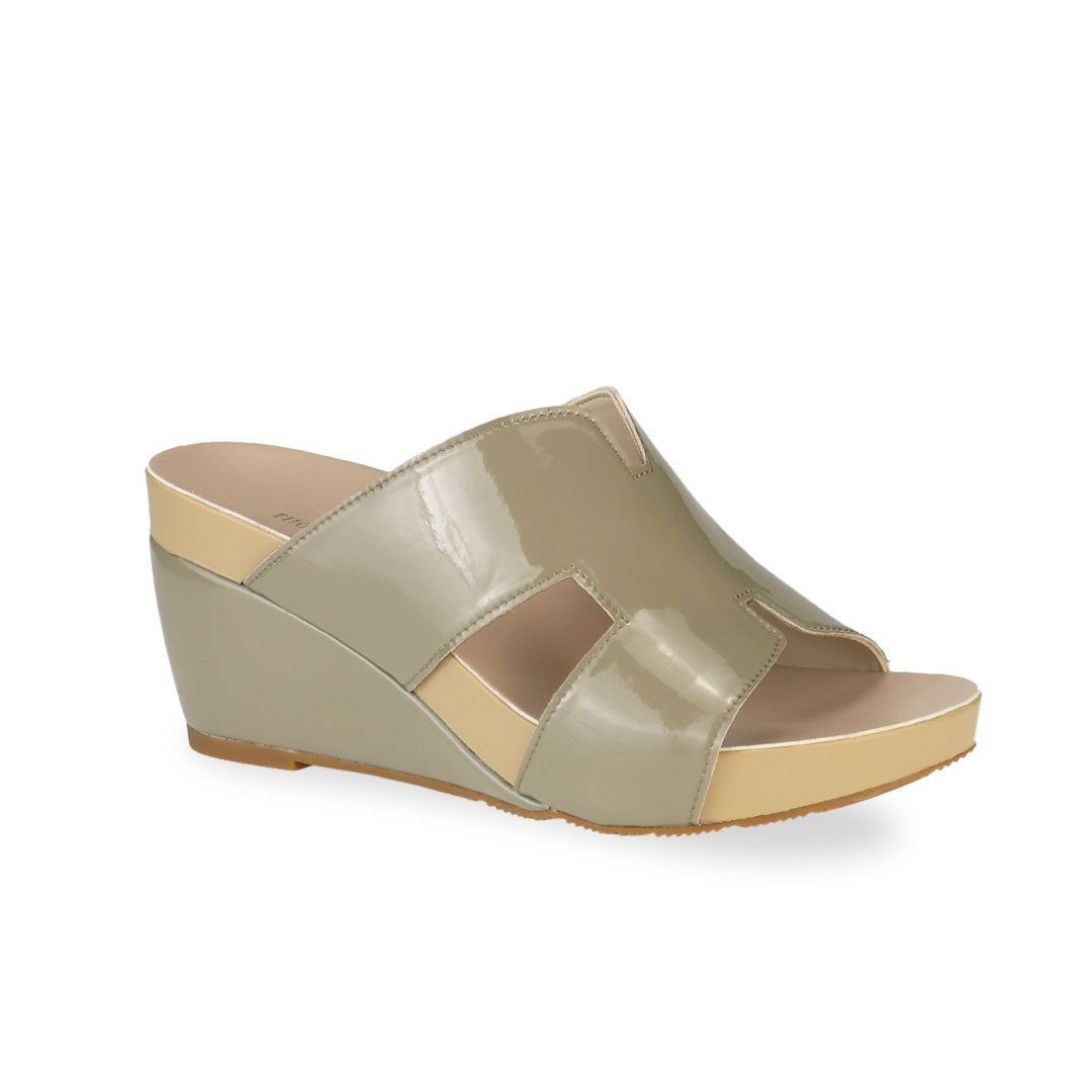 Diagonal view of Thomas Chan ivory green H-strap wedge sandals, featuring a simple, elegant design with comfortable wedges.