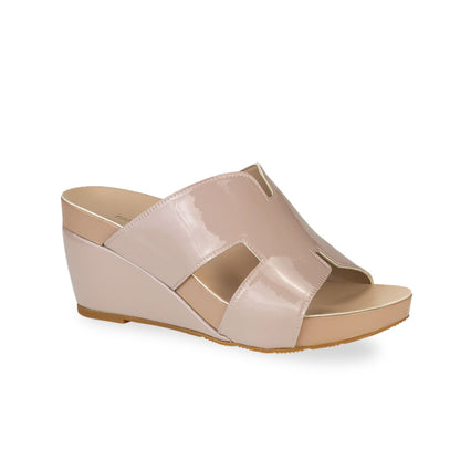 Diagonal view of Thomas Chan light taupe H-strap wedge sandals, featuring a simple, elegant design with comfortable wedges.