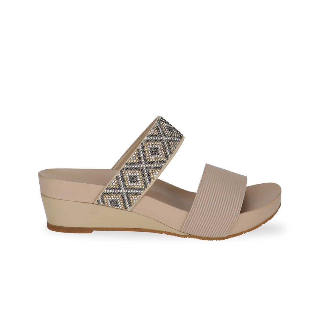 Side view of Thomas Chan sandy beige color comfortable boho-inspired strappy low wedge sandals