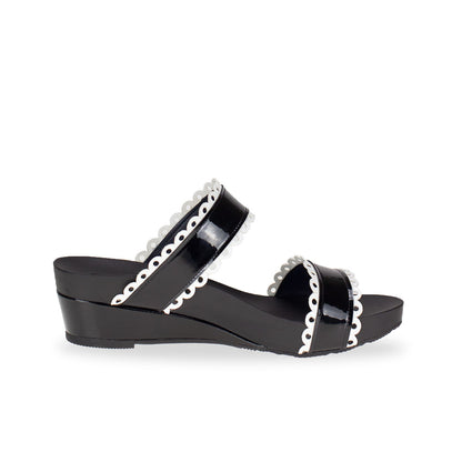 side view of comfortable cute Thomas Chan handmade slide sandals in black and white flower cutout strappy design