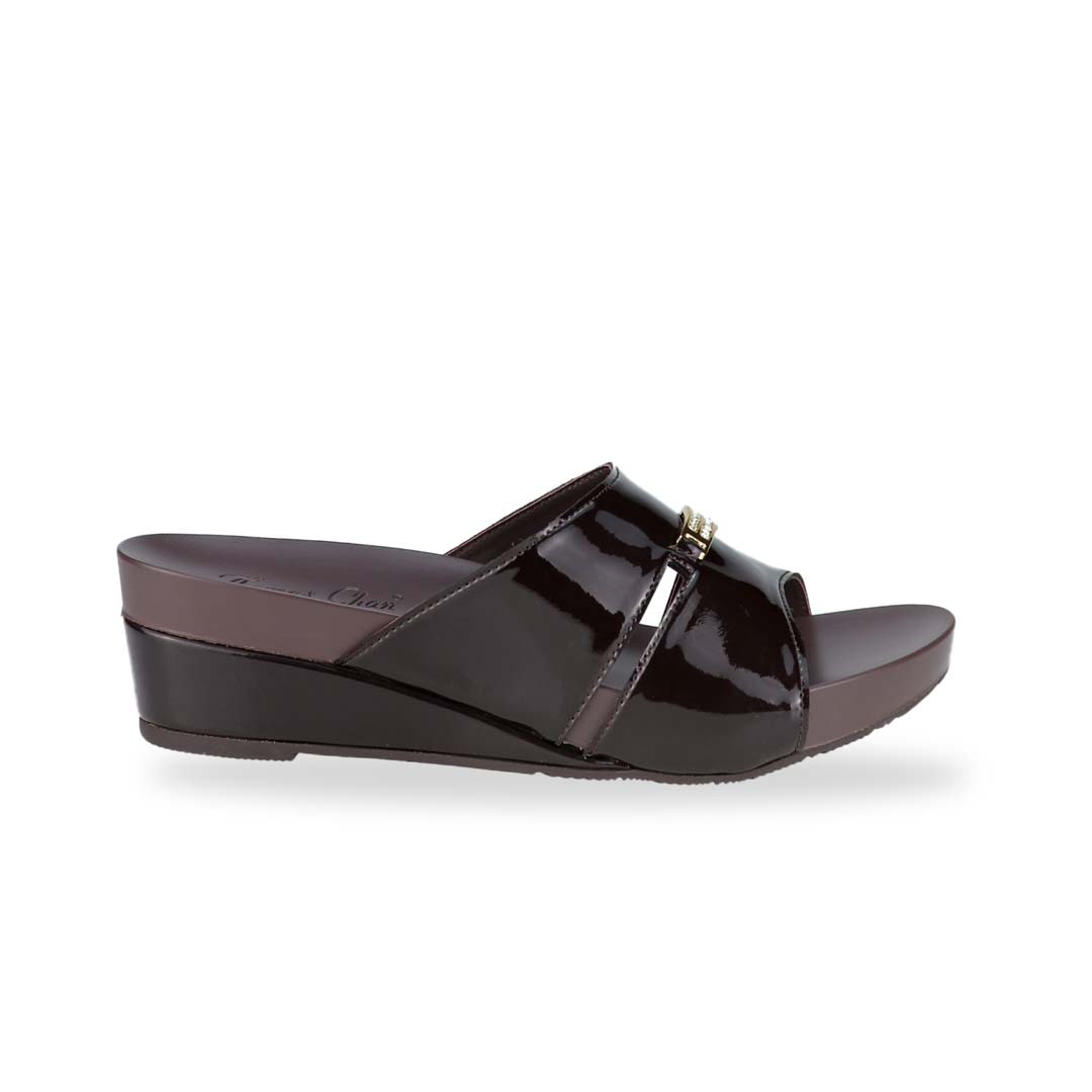 Side view of Thomas Chan's Mini Charm Low Wedge Sandals in dark chocolate, featuring small charm detail, a coverage design, and an arch-support footbed.