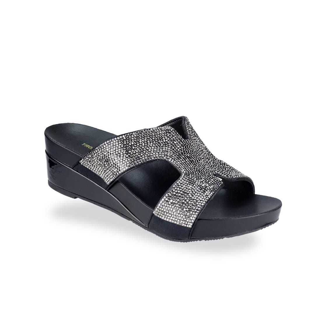 Diagonal view of Thomas Chan's H-strap Glamour Stone Low Wedges in black, adorned with glamour rhinestone detailing ,and an arch-support footbed.