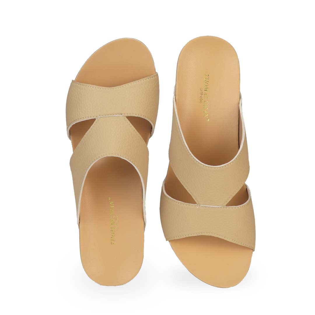 Front view of Thomas Chan's Pebble Lychee Everyday Low Wedge Slides in mustard cream, featuring an arch-support footbed. 