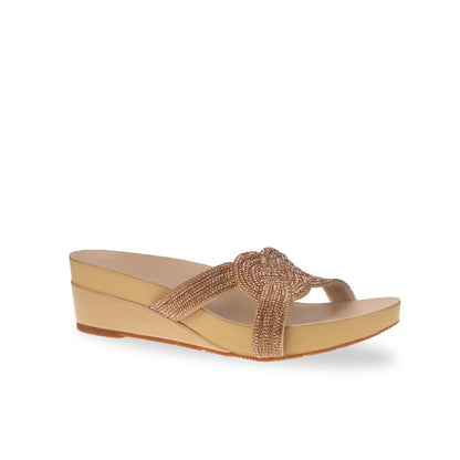 Diagonal view of Thomas Chan gold colour diamond detail knot-decor wedge sandals low heels, adorned with handpicked diamond straps and Thomas Chan® Orthotic Arch-elegance footbed for stylish comfort.