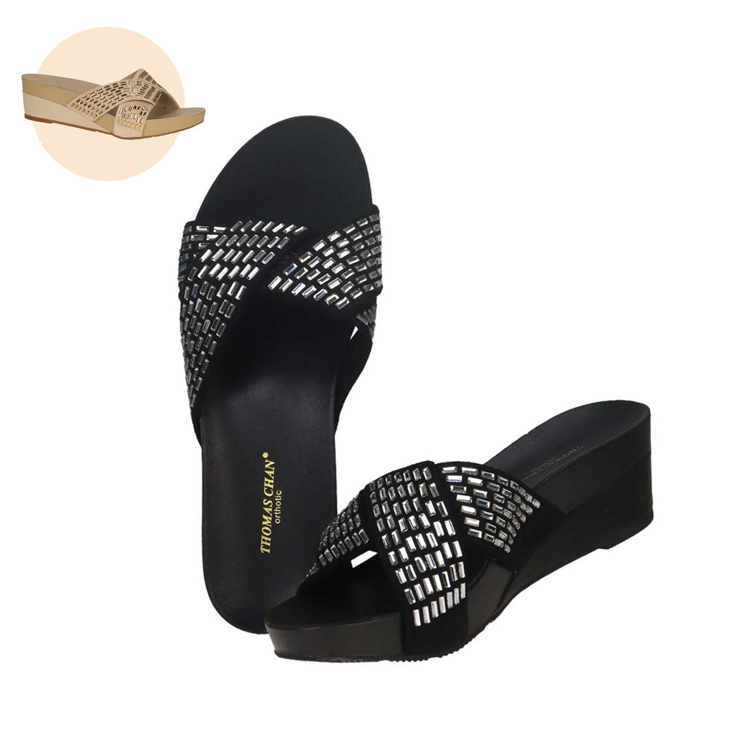  Thomas Chan's Diamond Detail Knot-Decor Wedge Sandals, available in black and gold. These low-heeled sandals are adorned with handpicked rectangular diamond stones and feature the Thomas Chan® Orthotic Arch-elegance footbed for stylish comfort.