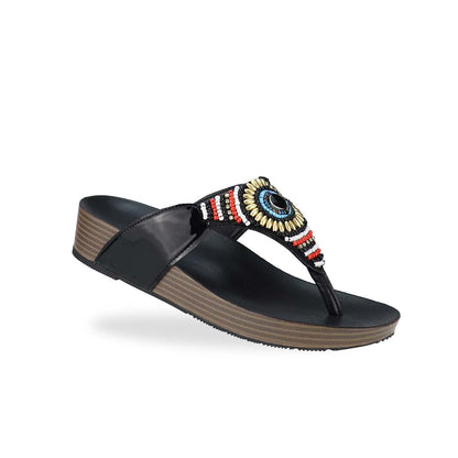 Diagonal view of Thomas Chan's Boho Beaded Flatform Flip-Flops in black, showcasing the boho beaded design and LiteStep flatform footbed. The image highlights the flip-flops' boho beaded accents and casual style.