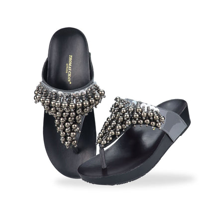 Full view of Thomas Chan's Pearl Tassel Flip-Flops from the LiteStep Collection. The sandals feature a glossy grey strap adorned with pearl tassel embellishments, paired with a comfortable flatform sole.