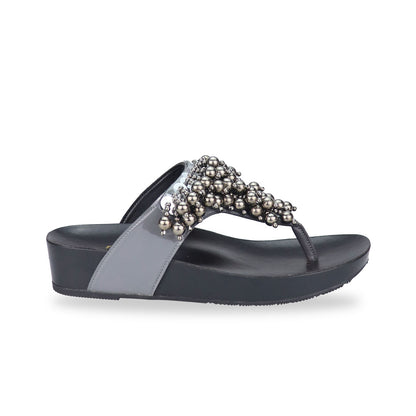 Side view of Thomas Chan's Pearl Tassel Flip-Flops from the LiteStep Collection. The sandals feature a glossy grey strap adorned with pearl tassel embellishments, paired with a comfortable flatform sole.