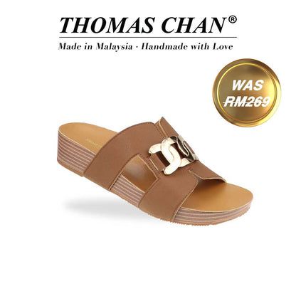 Diagonal view of Thomas Chan's Metallic Buckle H-Flatform Sandals in camel, a bold metallic gold buckle across the H-strap and LiteStep flatform footbed. 