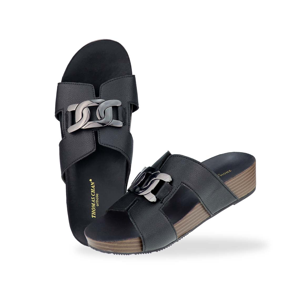 Full view of Thomas Chan's Metallic Buckle H-Flatform Sandals in black, featuring a bold metallic silver buckle on the H-strap and a cushioned LiteStep flatform footbed for added height and comfort.