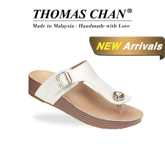 Diagonal view of Thomas Chan’s Dazzle Crystal Adjustable Flip-Flops in black, featuring a sparkling crystal stone, adjustable buckle strap, and LiteStep flatform footbed, highlighting their casual yet elegant style. The 'THOMAS CHAN®' brand logo is clearly visible, with the inscription 'Made in Malaysia · Handmade with Love' underneath. A gold and white banner showcases the special offer: 'New Arrival.'