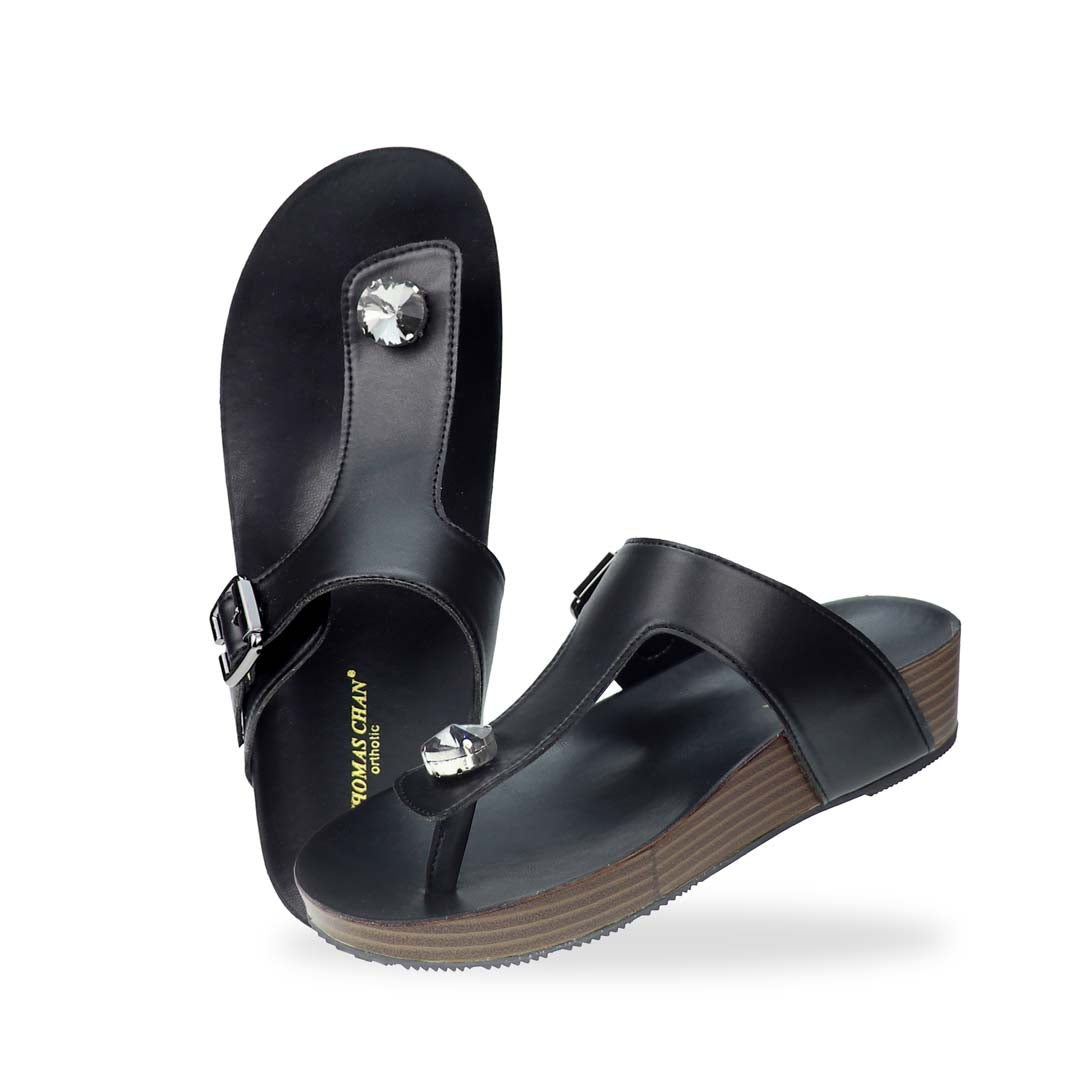 Full view of Thomas Chan’s Dazzle Crystal Adjustable Flip-Flops in black, featuring a sparkling crystal stone, adjustable buckle strap, and LiteStep flatform footbed, highlighting their casual yet elegant style.